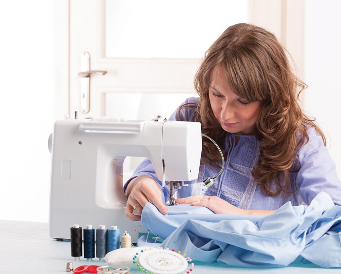 Daylight Sewing Machine lamp with woman sewing