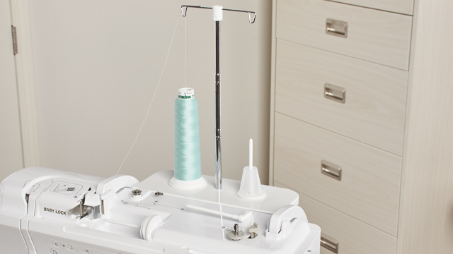 Baby Lock Ballad includes a two-thread spool stand