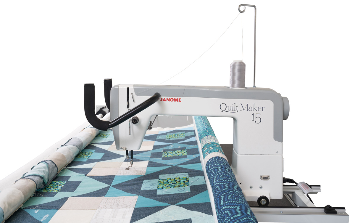 Side view of Janome Quiltmaker 15 Longarm with quilt