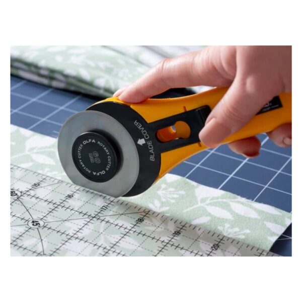 OLFA 60mm RTY-3/G Straight Handle Rotary Cutter cutting fabric