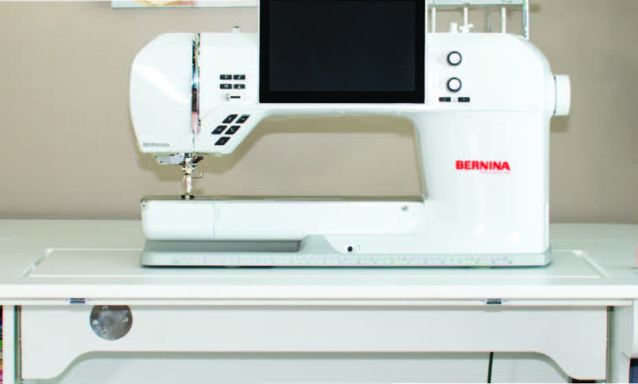 Cabinet in freearm position with machine on lift